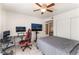 Bedroom features a neutral color scheme, fan, and gaming set up at 221 Mission Catalina Ln # 104, Las Vegas, NV 89107
