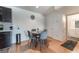 Cozy dining area with seating for four adjacent to an updated kitchen and bathroom access at 221 Mission Catalina Ln # 104, Las Vegas, NV 89107
