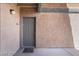 Neutral-colored front door with secure entrance to the home, complimented by a freshly painted and clean entry area at 221 Mission Catalina Ln # 104, Las Vegas, NV 89107