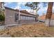 A one-story building with multiple windows and a red tile roof has manicured landscaping at 221 Mission Catalina Ln # 104, Las Vegas, NV 89107