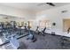 This spacious gym boasts a variety of exercise machines and ample mirror space, perfect for a full workout at 221 Mission Catalina Ln # 104, Las Vegas, NV 89107