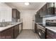Sleek kitchen with stainless steel appliances, tiled backsplash, and ample counter space for meal preparation at 221 Mission Catalina Ln # 104, Las Vegas, NV 89107