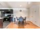 Inviting kitchen with modern appliances, dark cabinets, and an adjacent dining area with hardwood floors at 221 Mission Catalina Ln # 104, Las Vegas, NV 89107