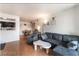 Open concept living room featuring modern furniture and wood-look floors throughout at 221 Mission Catalina Ln # 104, Las Vegas, NV 89107