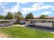 Community parking under metal structures with green landscaping at 221 Mission Catalina Ln # 104, Las Vegas, NV 89107