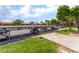 Community parking under metal structures with green landscaping at 221 Mission Catalina Ln # 104, Las Vegas, NV 89107