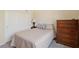 Cozy bedroom featuring a sliding closet door and a wooden dresser, offering ample storage at 2555 Moonlight Valley Ave, Henderson, NV 89044