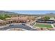 Aerial view of community center with tennis court, bocce ball court, and surrounding neighborhood at 2555 Moonlight Valley Ave, Henderson, NV 89044