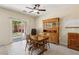 Charming dining area with a wooden table set and sliding glass doors leading to the backyard at 2555 Moonlight Valley Ave, Henderson, NV 89044