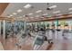 Well-equipped gym with various exercise machines and ample natural light from large windows at 2555 Moonlight Valley Ave, Henderson, NV 89044