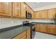 Modern kitchen design showcasing stainless steel appliances complemented by natural wood cabinetry for a warm ambiance at 2555 Moonlight Valley Ave, Henderson, NV 89044