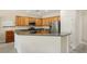 Bright kitchen boasts stainless steel appliances, wooden cabinetry, and an open breakfast bar for modern living at 2555 Moonlight Valley Ave, Henderson, NV 89044
