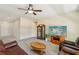 Open living room with neutral tones, display cabinet, and a TV area at 2555 Moonlight Valley Ave, Henderson, NV 89044