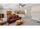 Expansive living room seamlessly connects to the kitchen with comfortable seating and a dining area at 2555 Moonlight Valley Ave, Henderson, NV 89044