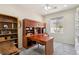 Study with built in cabinets, desk, and bookcase offering ample storage and a dedicated workspace at 2555 Moonlight Valley Ave, Henderson, NV 89044