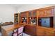 Study features built-in cabinets, shelves, and a desk, perfect for a functional and stylish workspace at 2555 Moonlight Valley Ave, Henderson, NV 89044