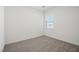 Cozy bedroom with natural light and plush carpeting at 2624 Lily Point St, Las Vegas, NV 89156