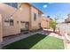 Backyard featuring a patio, astroturf and decorative plants and pots at 2745 Poppyseed Way, Las Vegas, NV 89142