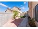 Backyard with a small patch of astroturf, plants and brick patio at 2745 Poppyseed Way, Las Vegas, NV 89142