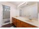 Bathroom with double sinks, large vanity, and a view to the bath and toilet area at 2745 Poppyseed Way, Las Vegas, NV 89142
