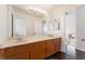 Bathroom featuring a large vanity with double sinks and a big mirror at 2745 Poppyseed Way, Las Vegas, NV 89142