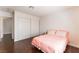 Bedroom with wood floors, a double bed and access to closet space at 2745 Poppyseed Way, Las Vegas, NV 89142