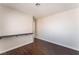 Bedroom with hardwood floors, white walls, custom desk and a door at 2745 Poppyseed Way, Las Vegas, NV 89142