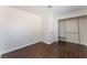 Bedroom with hardwood floors, white walls and a closet at 2745 Poppyseed Way, Las Vegas, NV 89142