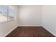 Bedroom with hardwood floors, white walls and a window at 2745 Poppyseed Way, Las Vegas, NV 89142