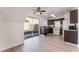 Kitchen features dark cabinetry, light countertops, white appliances, and a sliding door to the yard at 2745 Poppyseed Way, Las Vegas, NV 89142