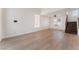 Bright living room boasts light wood floors, neutral walls, and staircase leading to the second level at 2745 Poppyseed Way, Las Vegas, NV 89142