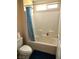 Bathroom showcasing a shower-tub combo with white tile surround and a decorative shower curtain at 2822 Chetco River St, Laughlin, NV 89029