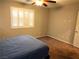 Bedroom with carpet flooring, ceiling fan, and window with shutters at 2822 Chetco River St, Laughlin, NV 89029