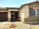 View of the front entrance and garage showcasing the home's inviting curb appeal at 2822 Chetco River St, Laughlin, NV 89029