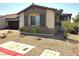 Charming single-story home with a desert-landscaped front yard, featuring gravel and young trees at 2822 Chetco River St, Laughlin, NV 89029