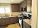Updated kitchen featuring granite countertops, gas range, and stainless steel appliances at 2822 Chetco River St, Laughlin, NV 89029