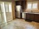 Kitchen features stainless steel appliances and white shutters on the window at 2822 Chetco River St, Laughlin, NV 89029