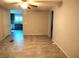Open living room with tile floors flows into the modern kitchen with stainless appliances at 2822 Chetco River St, Laughlin, NV 89029