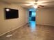 Living room featuring tile flooring, a ceiling fan, and view into kitchen area at 2822 Chetco River St, Laughlin, NV 89029