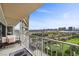 Balcony with a seating area and golf course views with city skyline in the background at 3111 Bel Air Dr # 21A & 21C, Las Vegas, NV 89109