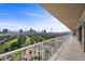 A long, spacious balcony with metal railings and a cityscape view at 3111 Bel Air Dr # 21A & 21C, Las Vegas, NV 89109