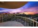 Balcony overlooking the Las Vegas Strip and golf course at sunset at 3111 Bel Air Dr # 21A & 21C, Las Vegas, NV 89109
