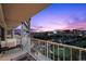 Balcony offers city and golf course views, featuring string lights, seating area, and tile floors at 3111 Bel Air Dr # 21A & 21C, Las Vegas, NV 89109