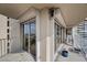 Large balcony with a cityscape view from sliding glass windows and a comfortable chair at 3111 Bel Air Dr # 21A & 21C, Las Vegas, NV 89109