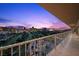 Enjoy a wide balcony overlooking the Las Vegas Strip and golf course at sunset at 3111 Bel Air Dr # 21A & 21C, Las Vegas, NV 89109