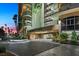 Luxurious entrance of Regency Towers with well-lit driveway and professionally landscaped surroundings at 3111 Bel Air Dr # 21A & 21C, Las Vegas, NV 89109