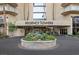 Regency Towers entrance featuring a circular garden and clear signage for visitors at 3111 Bel Air Dr # 21A & 21C, Las Vegas, NV 89109