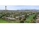 Expansive city view from above lush neighborhood and golf course at 3111 Bel Air Dr # 21A & 21C, Las Vegas, NV 89109