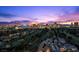 Nighttime skyline view of Las Vegas Strip over lush green golf course at 3111 Bel Air Dr # 21A & 21C, Las Vegas, NV 89109