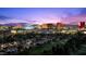 Expansive Las Vegas skyline view at twilight over a neighborhood and golf course at 3111 Bel Air Dr # 21A & 21C, Las Vegas, NV 89109